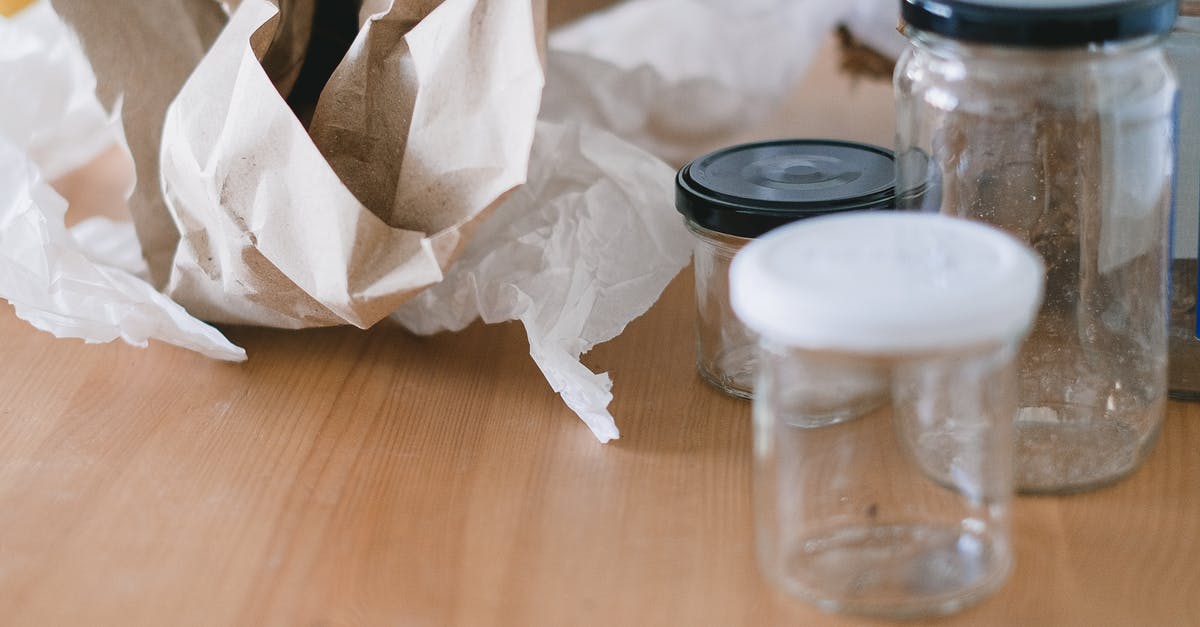 Must a lid for a pot used for steaming be vented? - Glass jars and crumpled paper on wooden table Must a lid for a pot used for steaming be vented? - Glass jars and crumpled paper on wooden table
