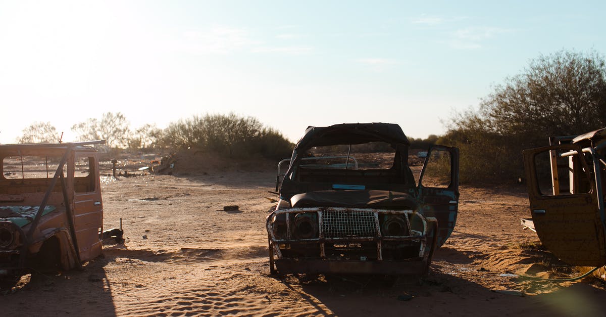 My cast iron has become flaky, did I damage it? - Rusty broken cars placed on sand