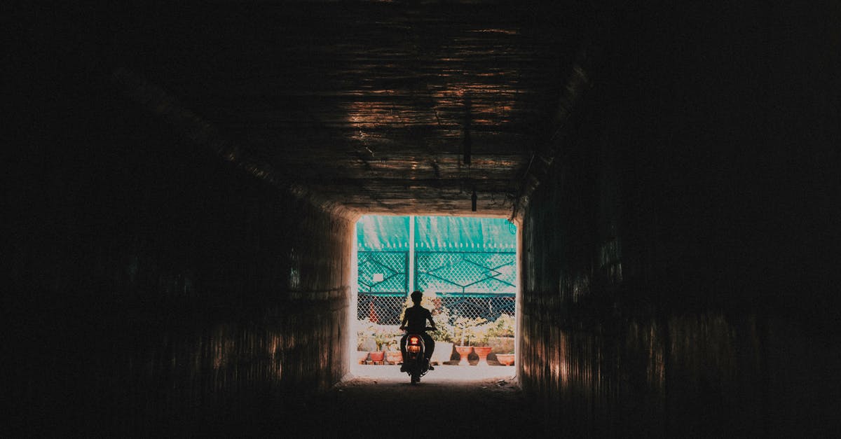 my chest freezer is going out. - Person Riding a Motorcycle Going out from the Tunnel