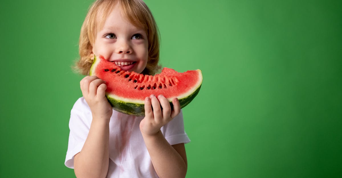 My curry is going funny I don't know why - Girl in White Shirt Holding Green Watermelon