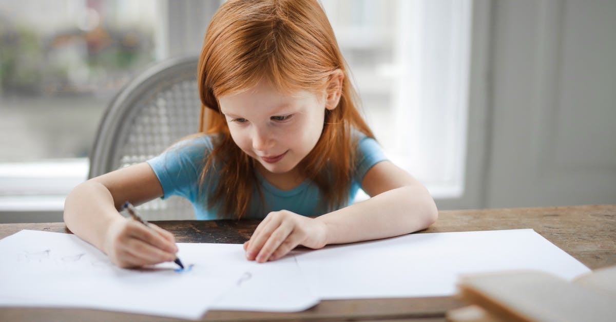My ginger is blueish... is it safe? - Diligent small girl drawing on paper in light living room at home