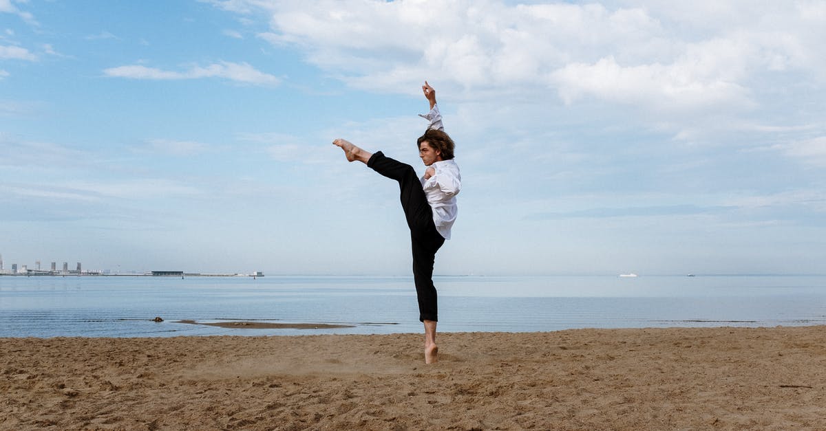 My sourdough splits at final proofing (pic included), advice? - Woman in White Long Sleeve Shirt and Black Pants Standing on Brown Sand Near Body of during