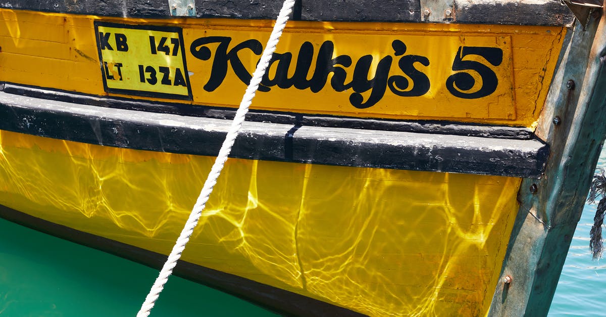 My sourdough starter has turned yellow is it still good? - Yellow bright boat with reflection of water on coast of calm ocean in daytime