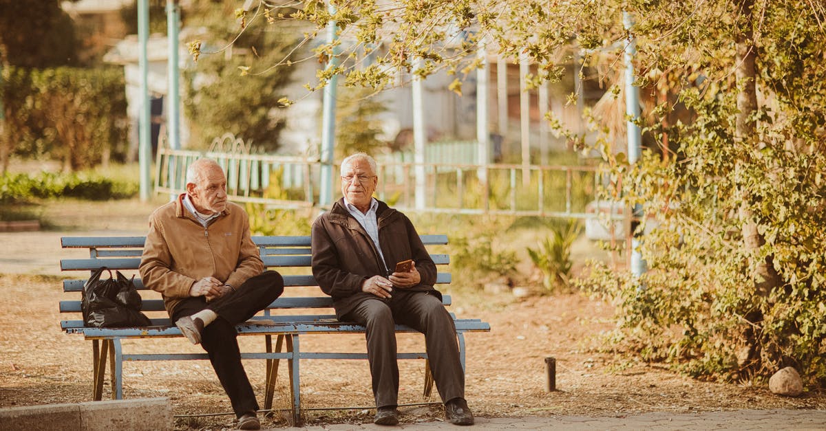 My sourdough starter stopped growing after day two - Two Old Men Sitting on Bench in Park in Autumn