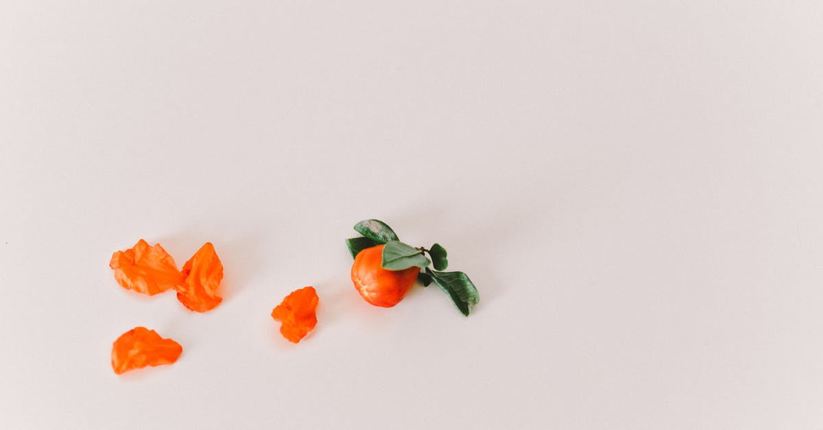 Name of a greek spice that sounds like "bakari" - Orange Flowers on White Surface