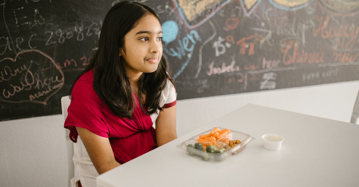 Name of the snack (possibly Indian) - Girl Eating Her Snack by Herself