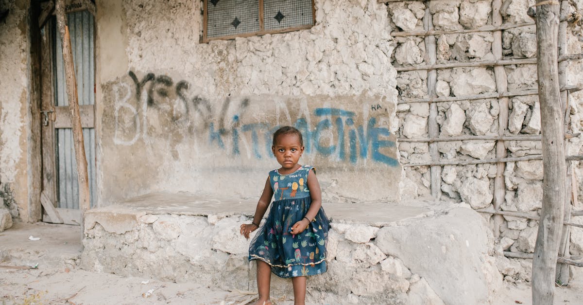 Need chewiness and density added to blondies no carbs - Little black girl sitting on rough stone border in ghetto