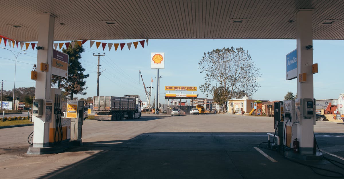 Nitrous oxide gas leak when charging ISI whipping cream dispenser - Empty gas station with oil petrol dispensers located on highway for serving long distance vehicles