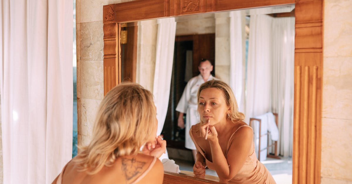 Nixtamalization: Am I doing it right? - Woman Looking in Mirror in Bathroom Doing Makeup