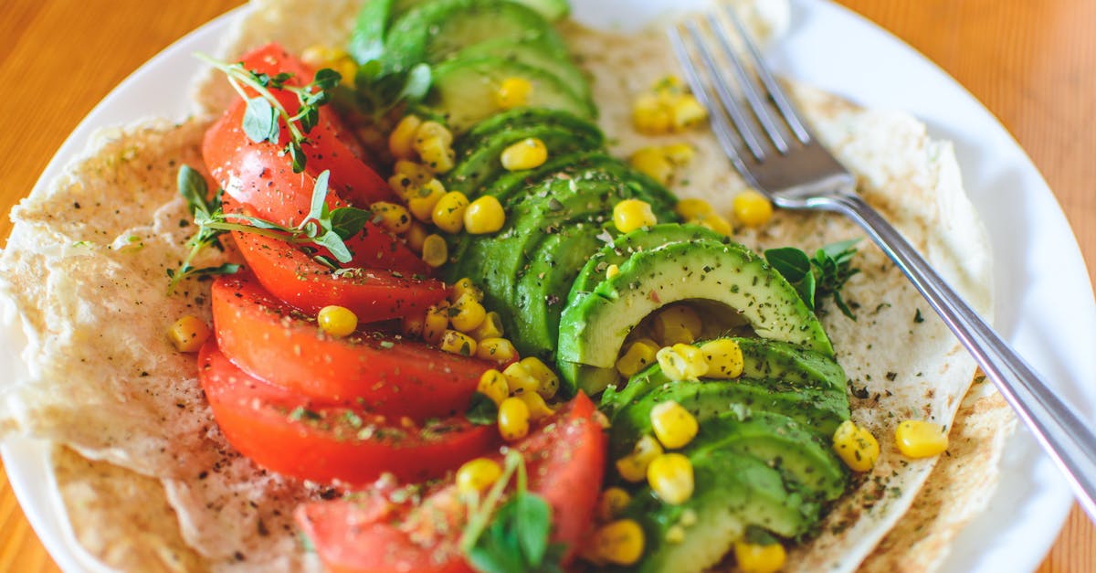 Nixtamilizing Corn for Tortillas - Sliced Tomato and Avocado on White Plate