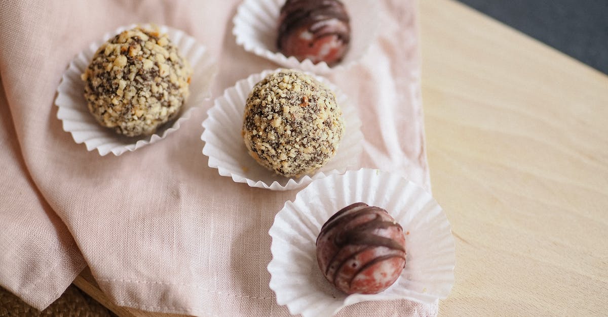 Non-plastic cutting board that can be cleaned in a dishwasher - Sweet Balls in Cupcake Paper Cups on Pink Serviette