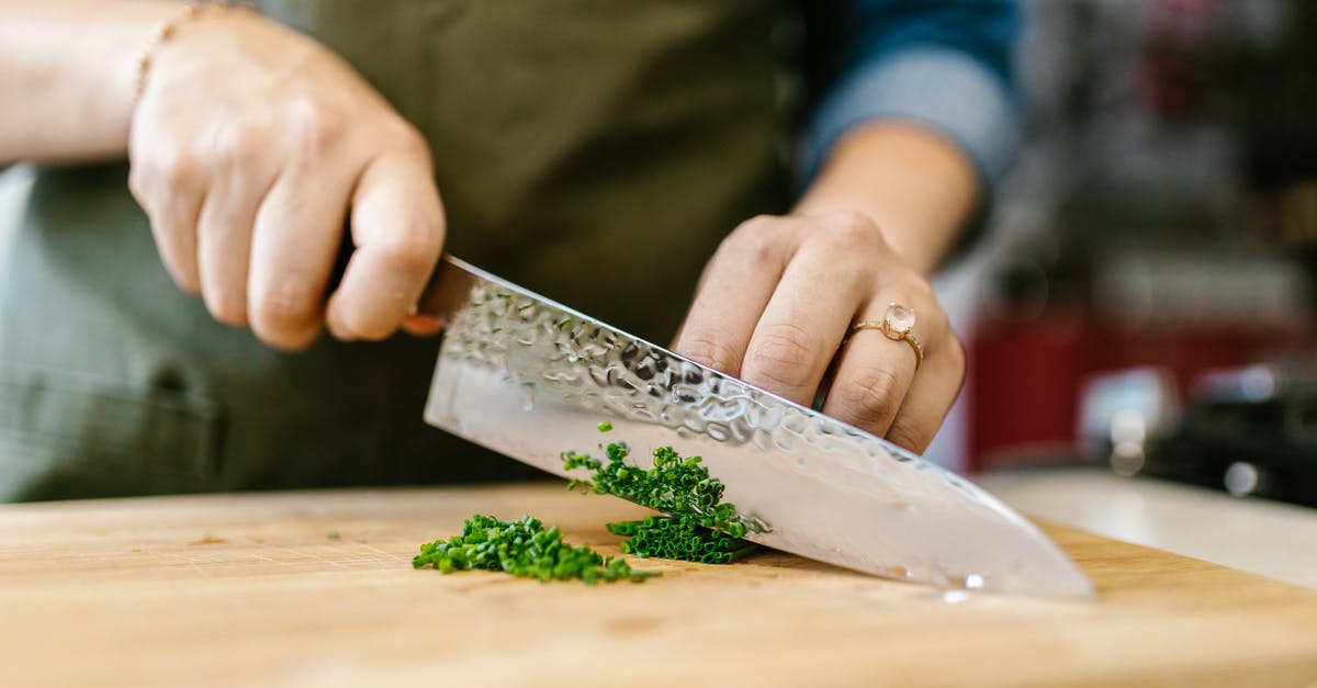 Non-plastic cutting board that can be cleaned in a dishwasher - Chef Cutting Vegetables