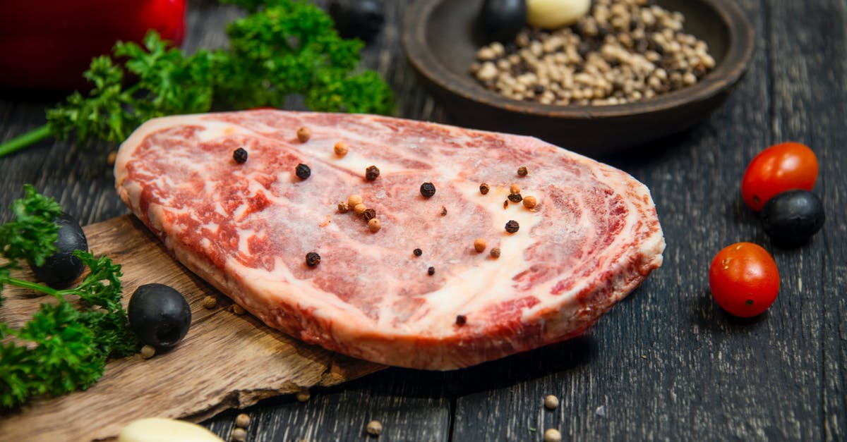 Not a tender steak - Sliced Pizza on Black Wooden Table