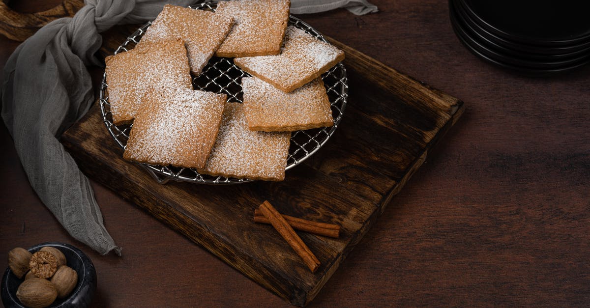 Nuts and raisins don't stick to cookies after baking - Biscuits on Mesh Wire and Cinnamon Sticks