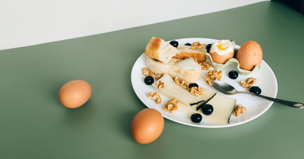 Nuts in Italian cooking - Brown Egg on White Ceramic Plate