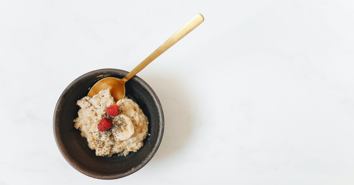 Oat starch to sugar conversion in oat milk - Brown Wooden Spoon on Black Ceramic Bowl