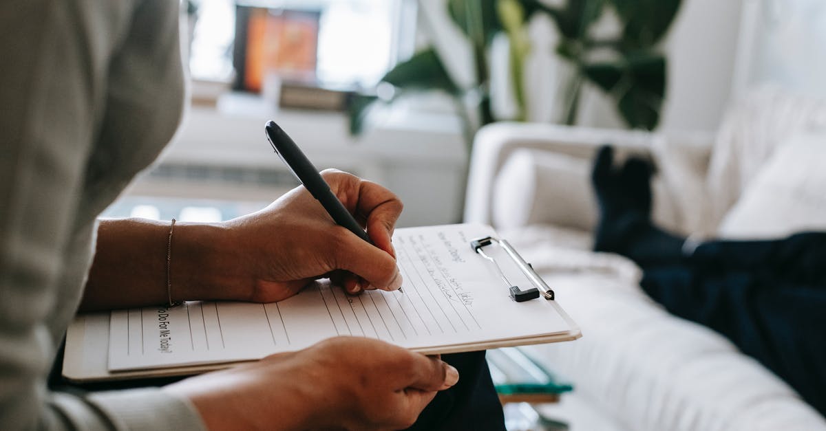 Office (Loose Leaf) Tea Solution - Unrecognizable ethnic female therapist taking notes on clipboard while filling out form during psychological appointment with anonymous client lying on blurred background