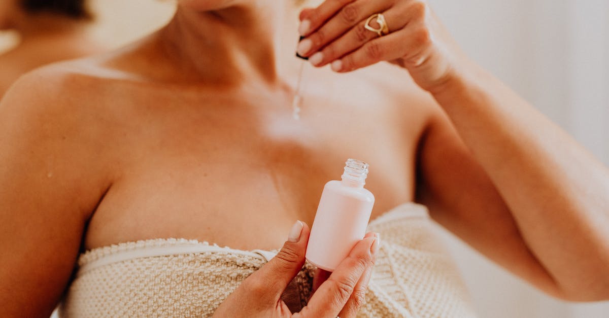 Oil temp goes up when turkey breast is added - why? - Woman Holding White Plastic Bottle