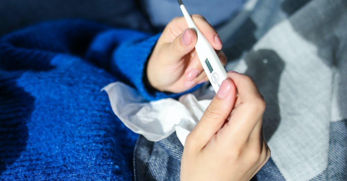 on proper thermometer poking? - Person Holding Thermometer