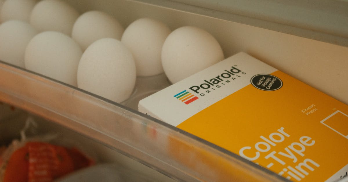 Once unwashed eggs have been refrigerated, must they remain so? - White Eggs Beside Polaroid Film