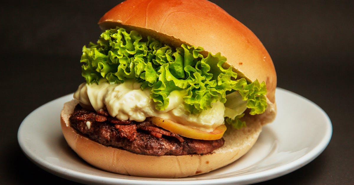Onion soup: How to chop the onion and what kind of cheese to put in it? [closed] - Burger With Lettuce and Cheese on a White Plate