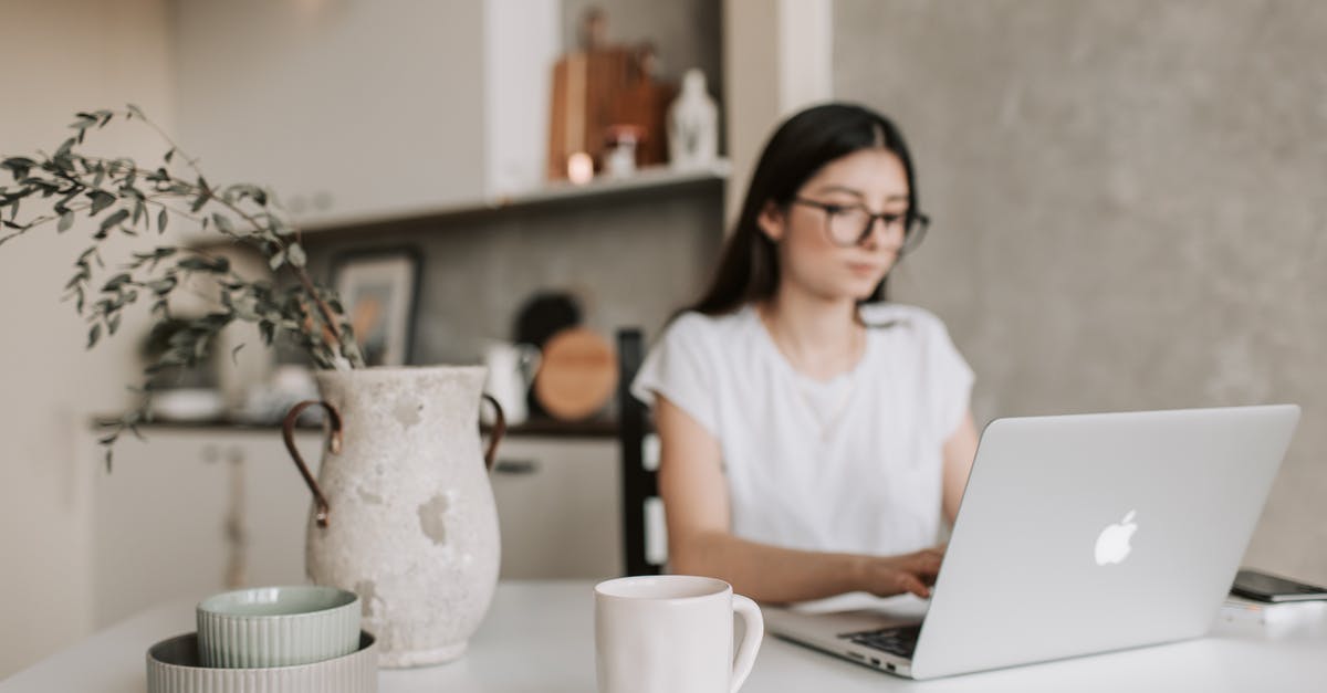 Opaque green tea, what is that? - Focused young businesswoman working remotely at home