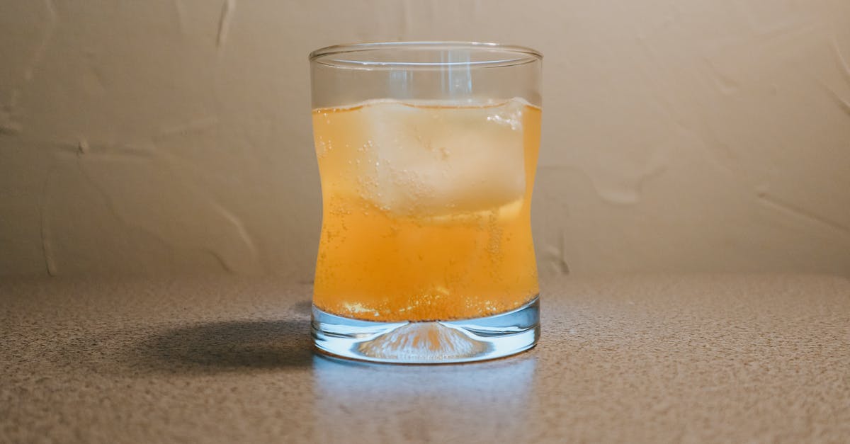 Orange juice preservation by chemical presevatives - Clear Drinking Glass With Brown Liquid