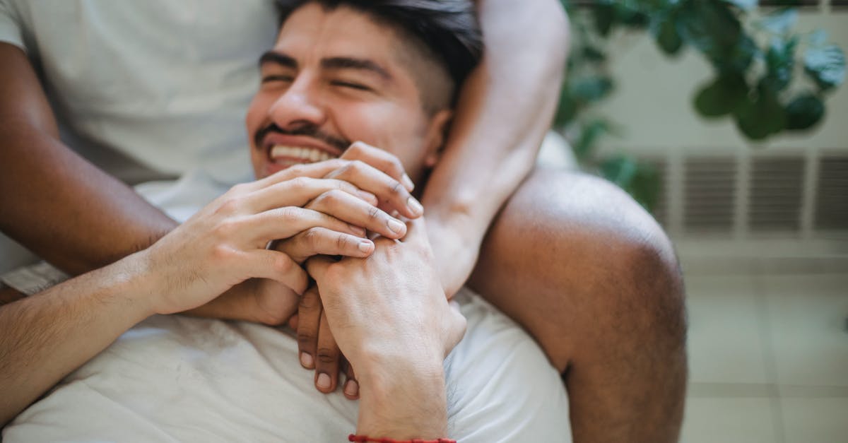 Other than US FDA definition, are there other standards for vanilla extracts? - Unrecognizable Man Hands Embracing Other Man by Neck