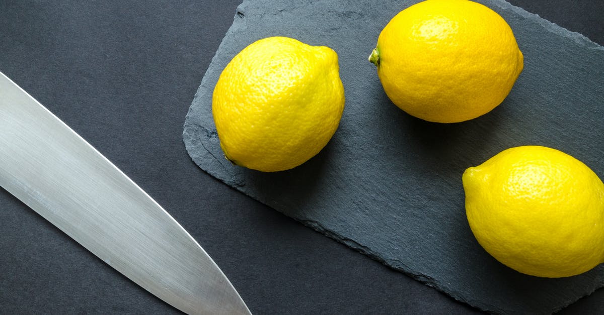 Ought food processor blades be sharpened or replaced? - Photo of Three Lemons on Chopping Board Near Knife