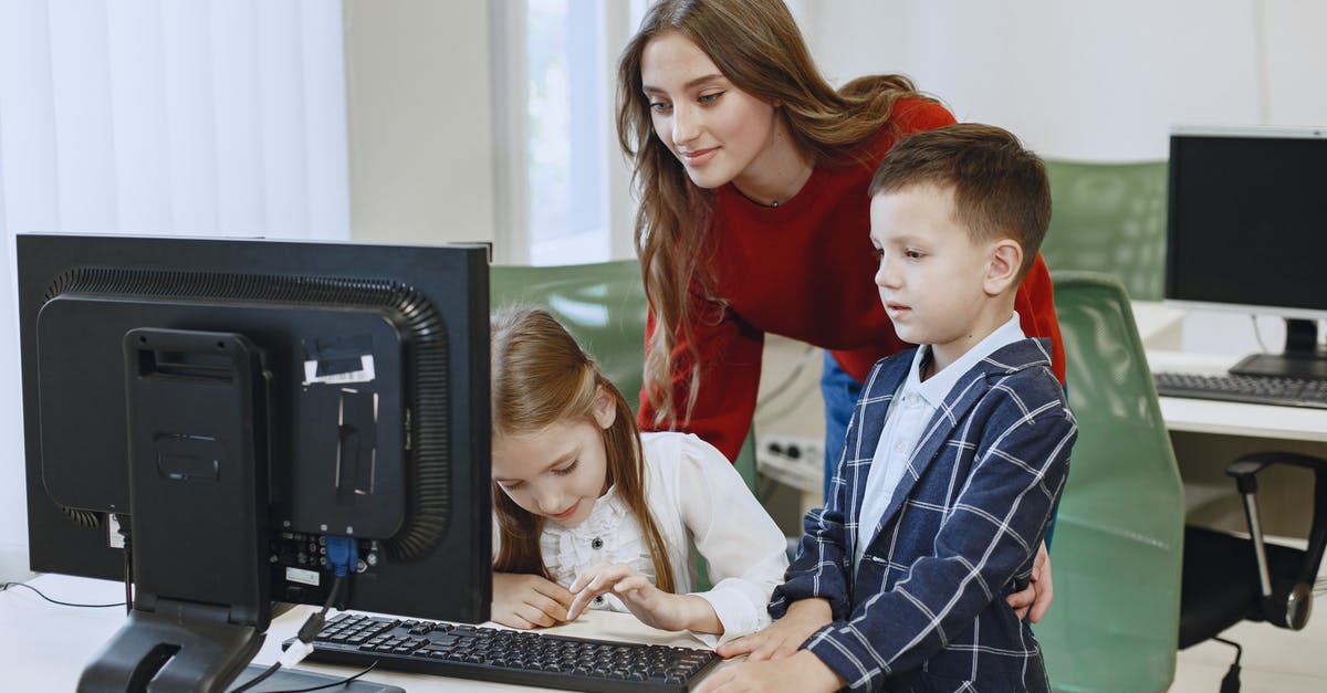 Our broiler "ruins" pans when we use it - Teacher with Children Using Computer