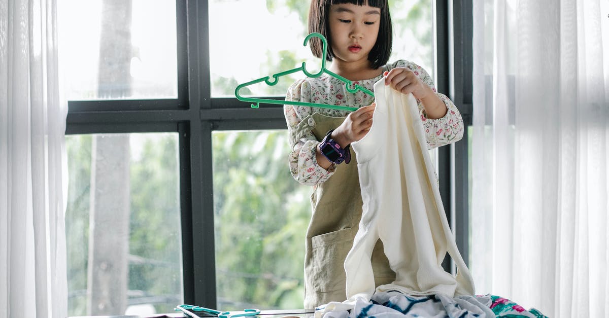 oven cleaning help and tips - Little girl doing housework in room