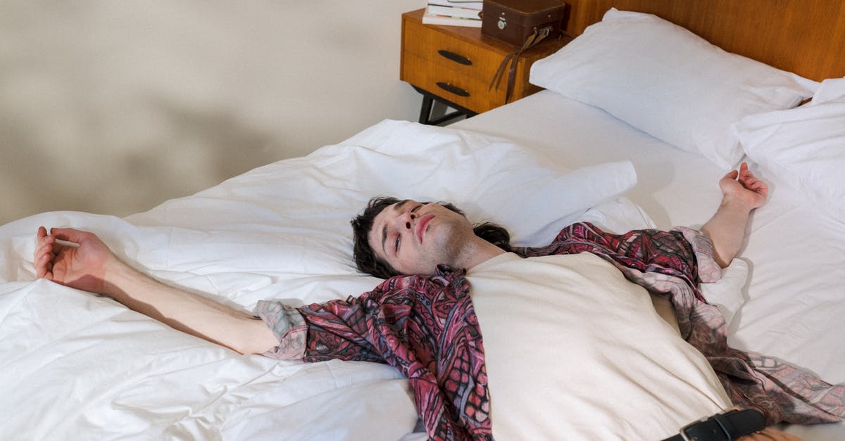 Oven is leaking steam out the back - Young Man Laying on Back in Bed and Chilling Out