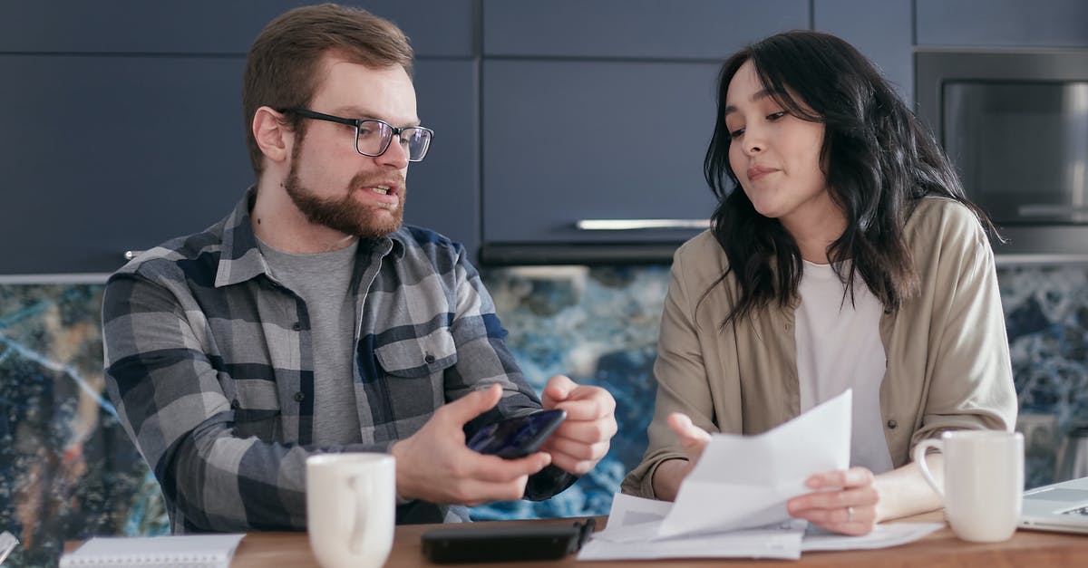 Oven problems in VA - Man and Woman Sitting at Table