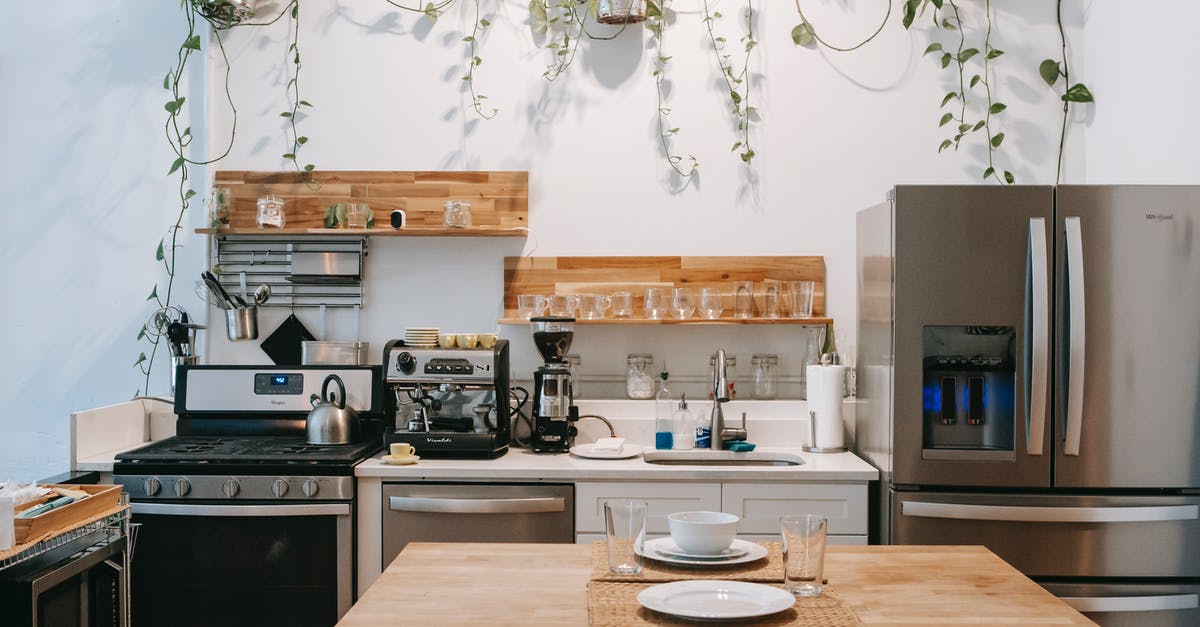 Oven setting for pizza - Interior of modern kitchen with dining table