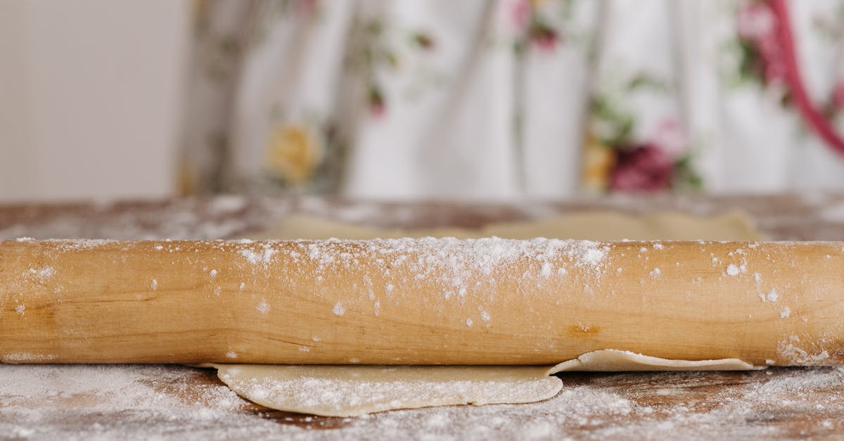 Over kneaded dough: what can I do with it? - Close-Up Shot of a Rolling Pin