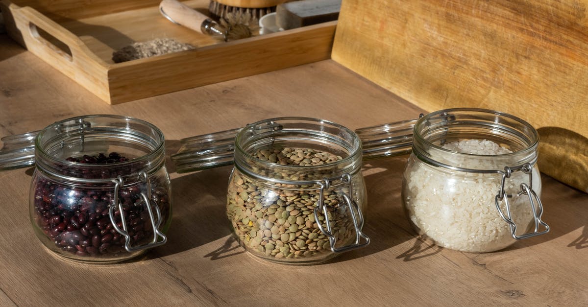 Oyama rice cooker - uncooked rice under heating element - Clear Glass Jars with Raw Beans, Seeds and Rice on Brown Wooden Table