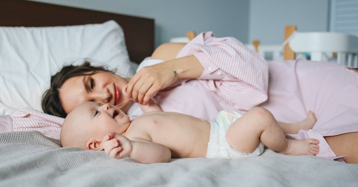 Pan size affecting evaporation time - Mother Lying Down on Bed Next to Her Baby