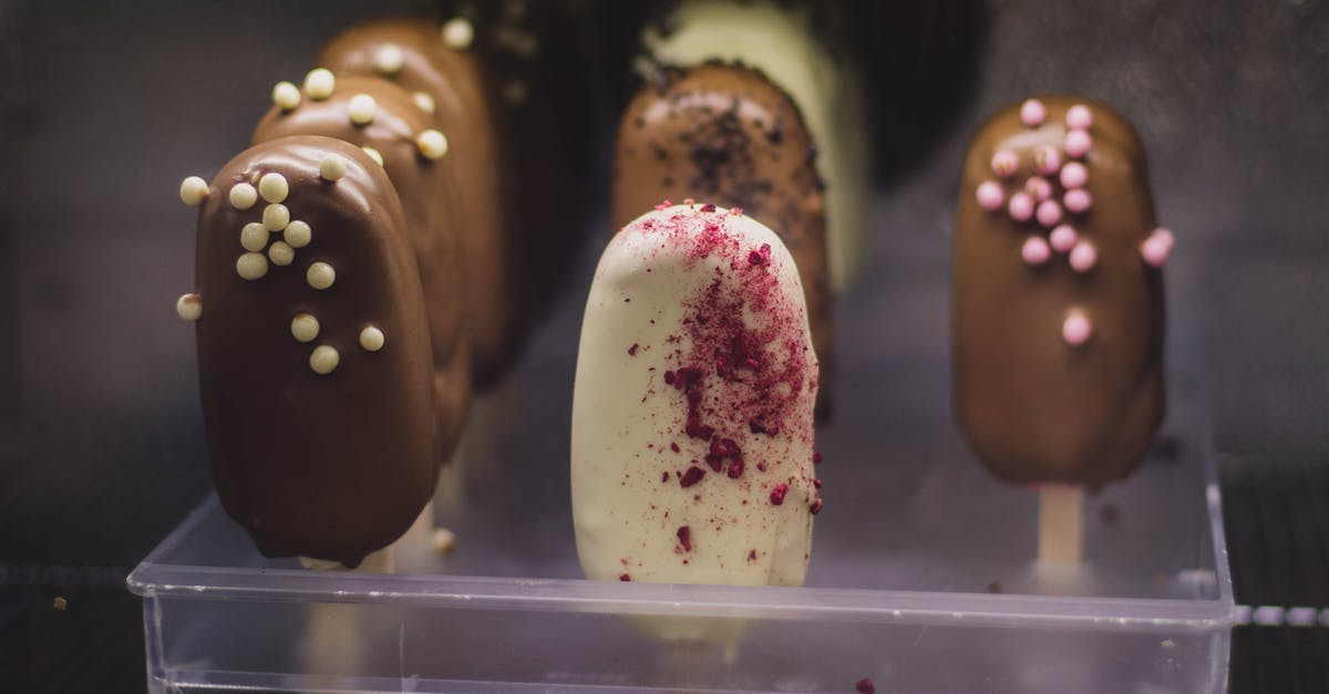 pan size and cream pull candy - Close-Up Photo Of Chocolate Covered Popsicle