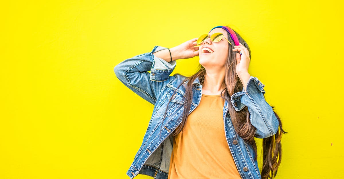 Panda Express style Chow Mein - Smiling Woman Looking Upright Standing Against Yellow Wall