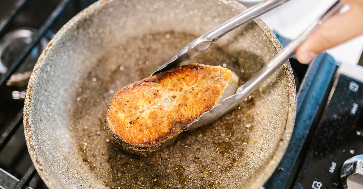 Pan-frying fish filets with skin on - Holding Fish Meat on Pan with Pincers