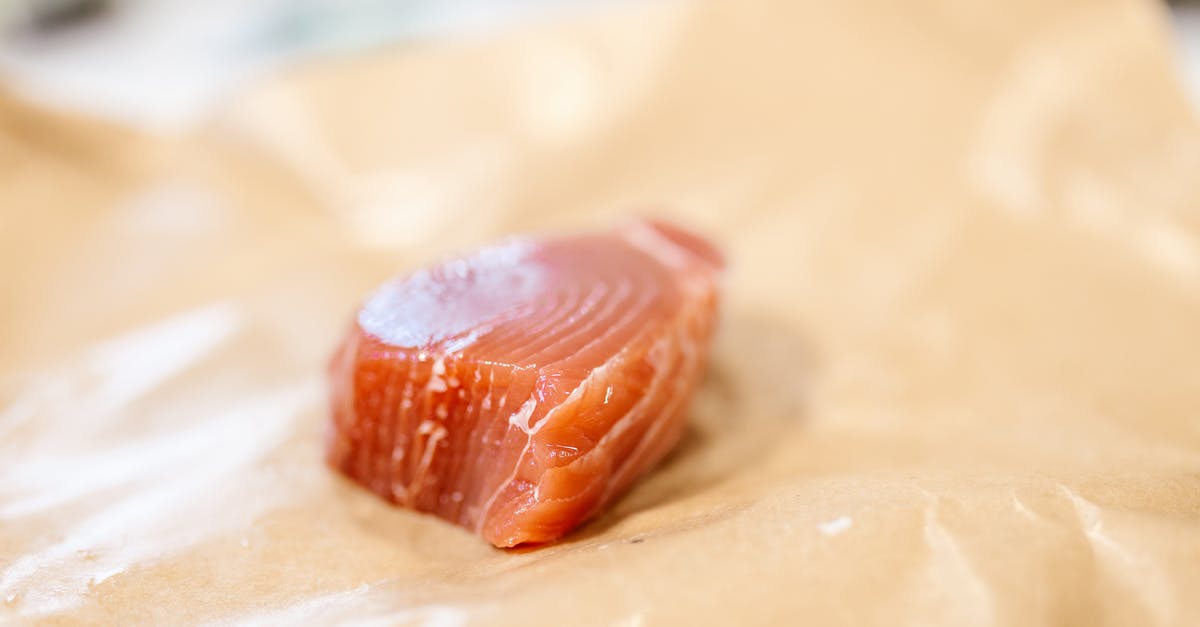 Pan-frying Salmon before baking it - Chunk of Salmon Meat Laying on Baking Paper