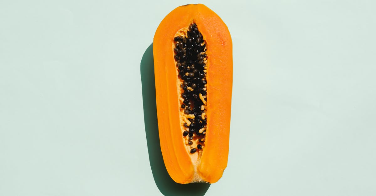 Papaya ripe or over ripe - Half of exotic ripe papaya with seeds