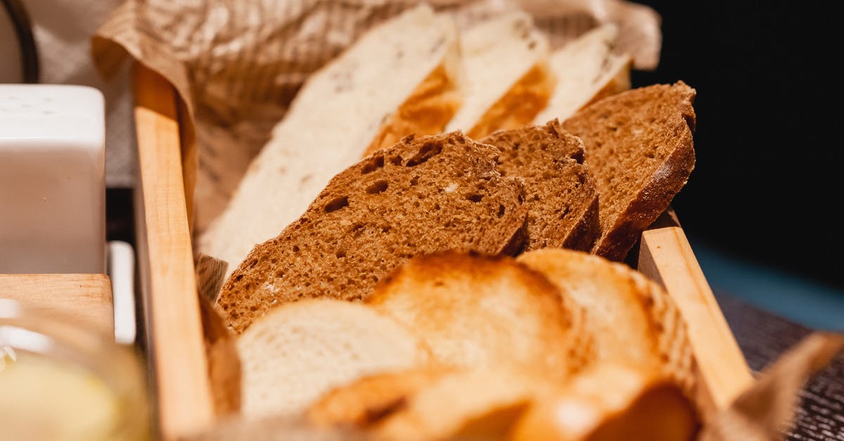 Parchment vs baking paper - Assorted bread pieces in box on table