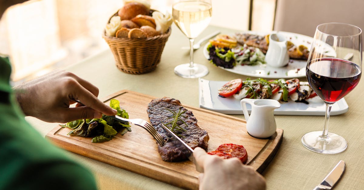 partially cooked meats - Brown Wooden Chopping Board With Green Vegetable and Meat Dish