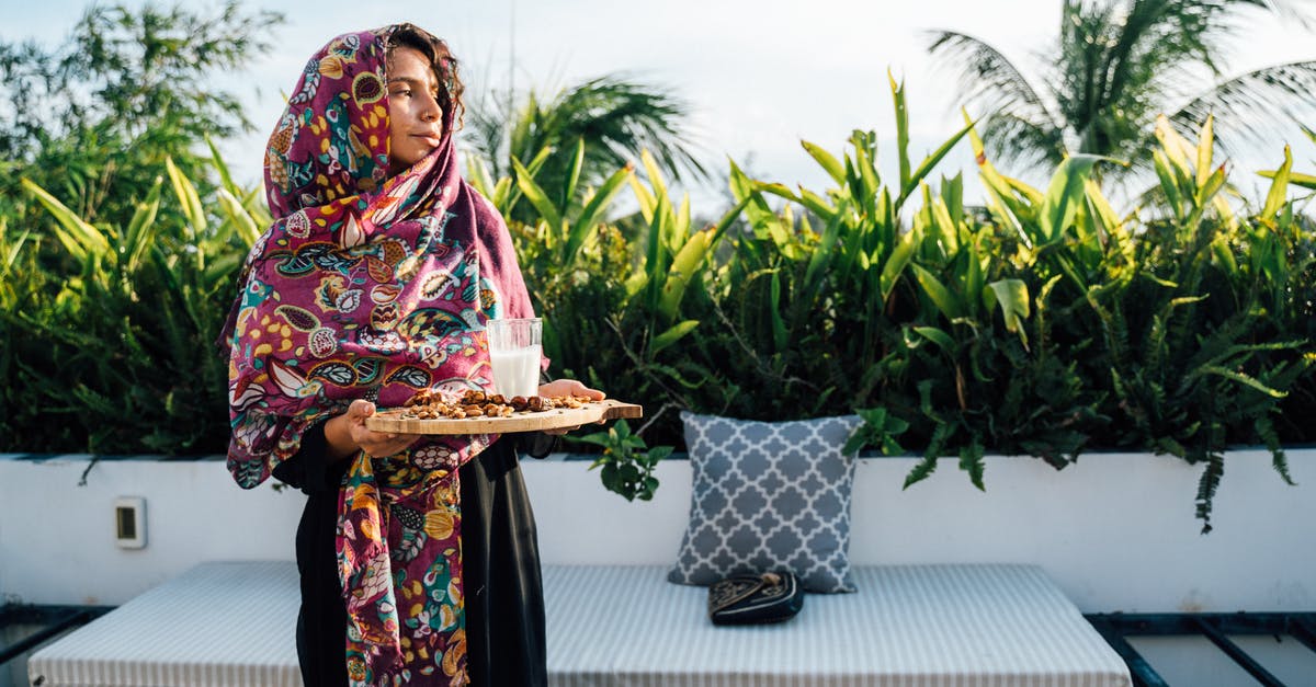 Pasteurized milk boiling dilemma - Woman in Black and Pink Floral Dress Holding White Tray With Food