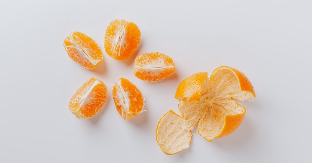 Patina peel off on newly seasoned wok - Peeled fresh juicy ripe slices of mandarin