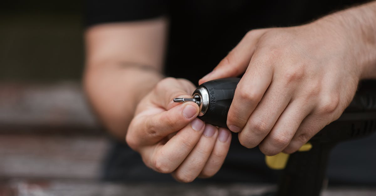 Pemmican -- how was it prepared without metal tools? - Faceless technician preparing electric drill for job