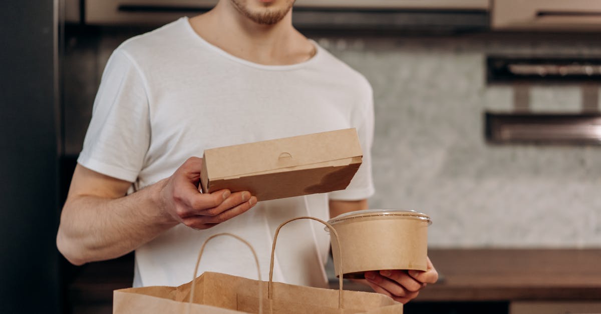 PET containers for freezer meals? - A Man in White Shirt Taking Out Food Delivery from the Bag