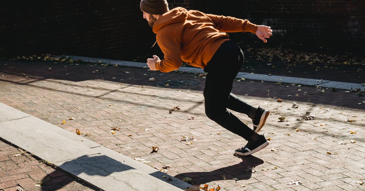 Physical method to season steaks - Energetic faceless man running on pavement