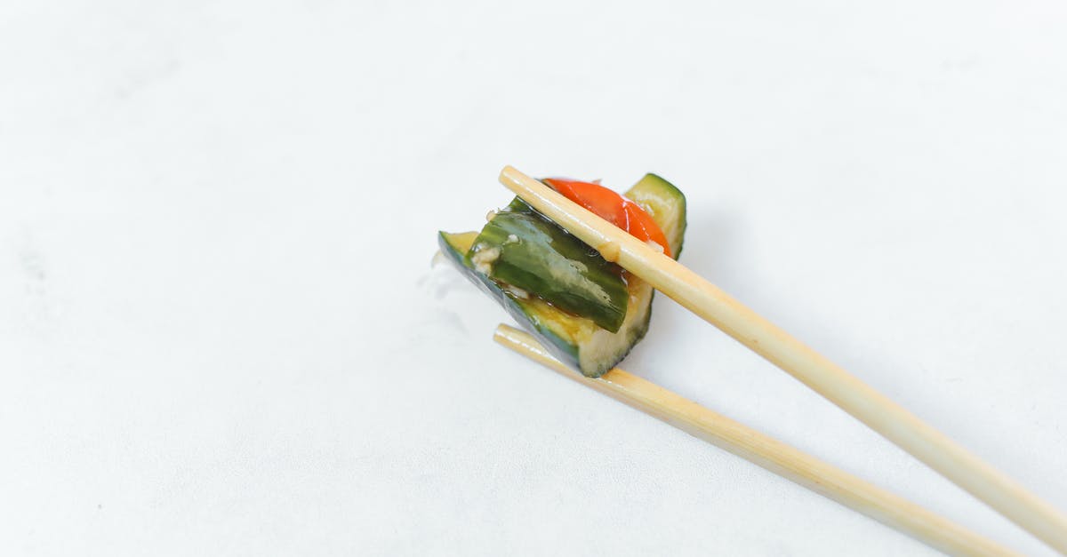 pickled cucumbers seemingly lasting "forever" - Close Up Photography of Pickled Cucumber on Chopsticks